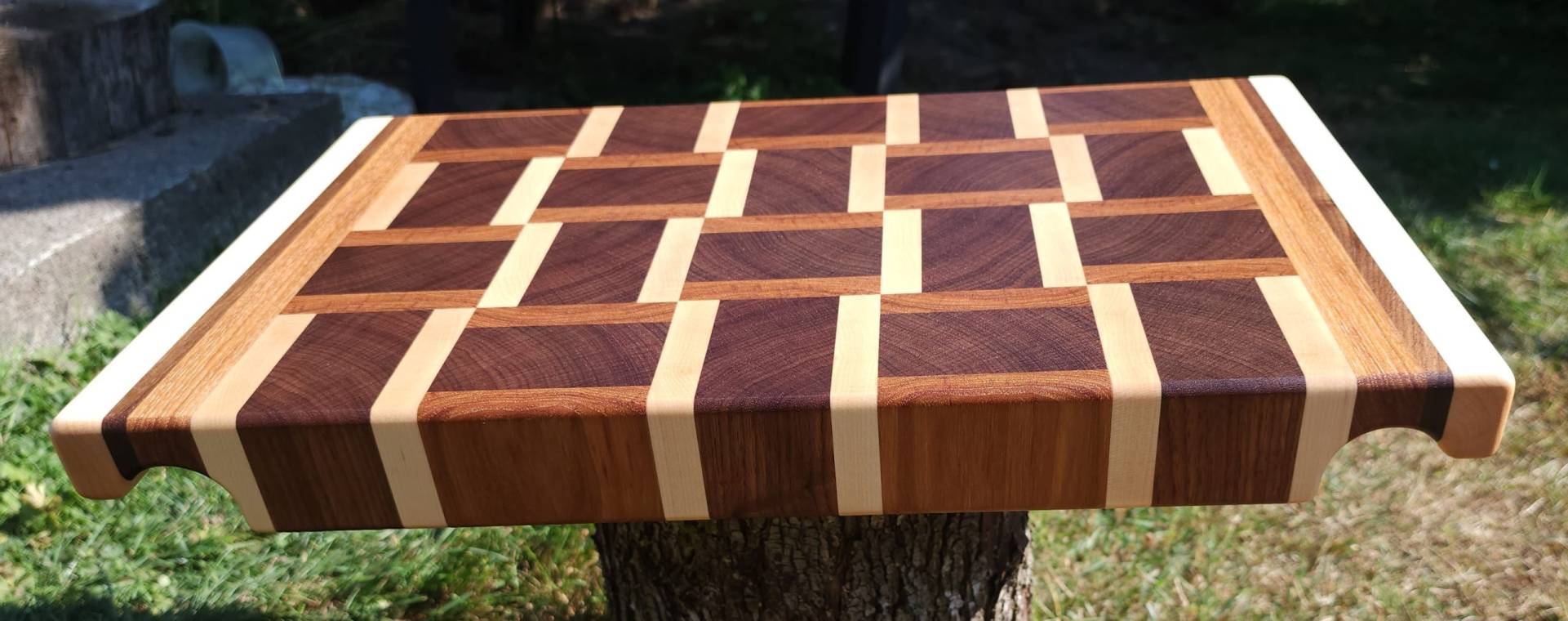 Cutting board made with interchanging pieces of wood